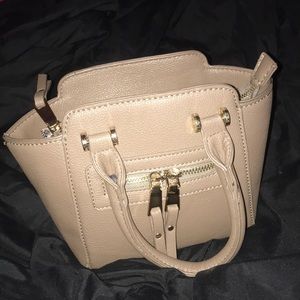 A mini Madison West hand bag